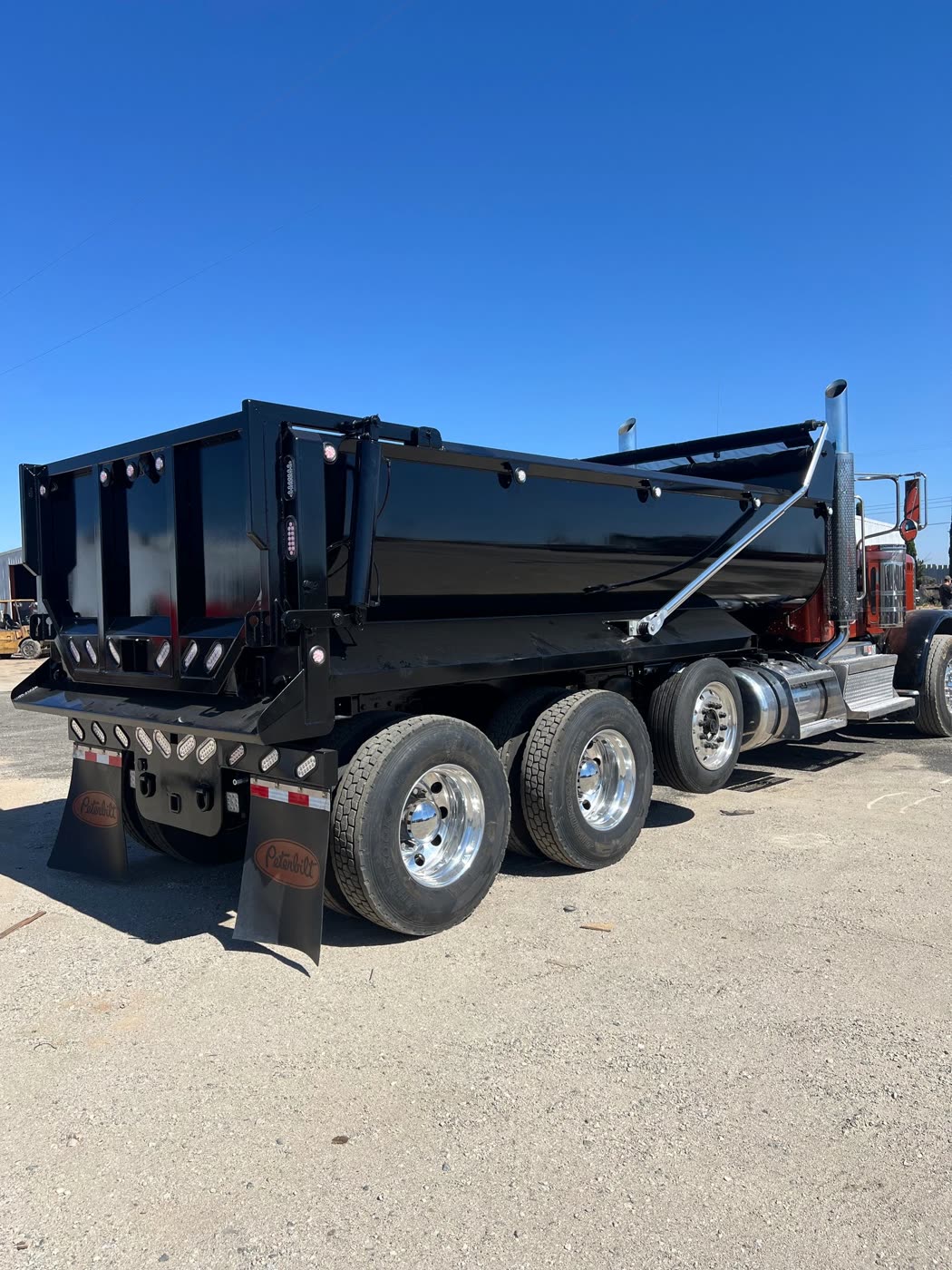 Air operated tailgate with double lock on a DM Welding dump body
