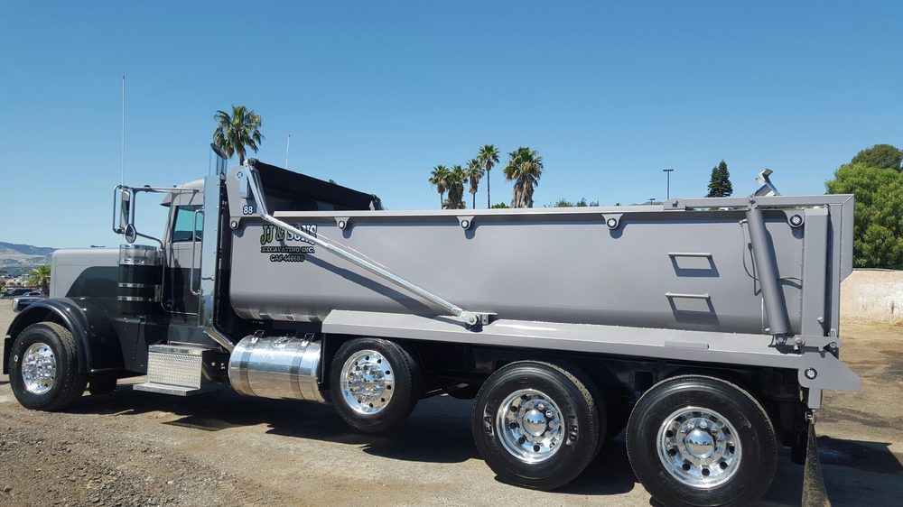 Gray dump body seen square from the side