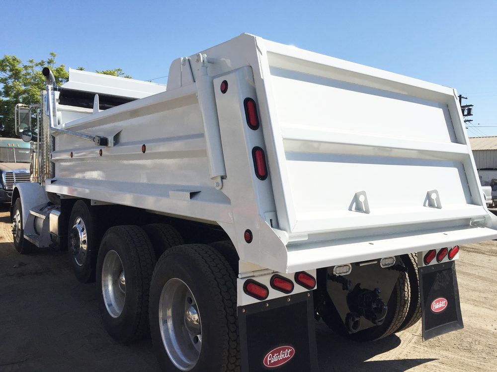 White dump body, rear three quarter view