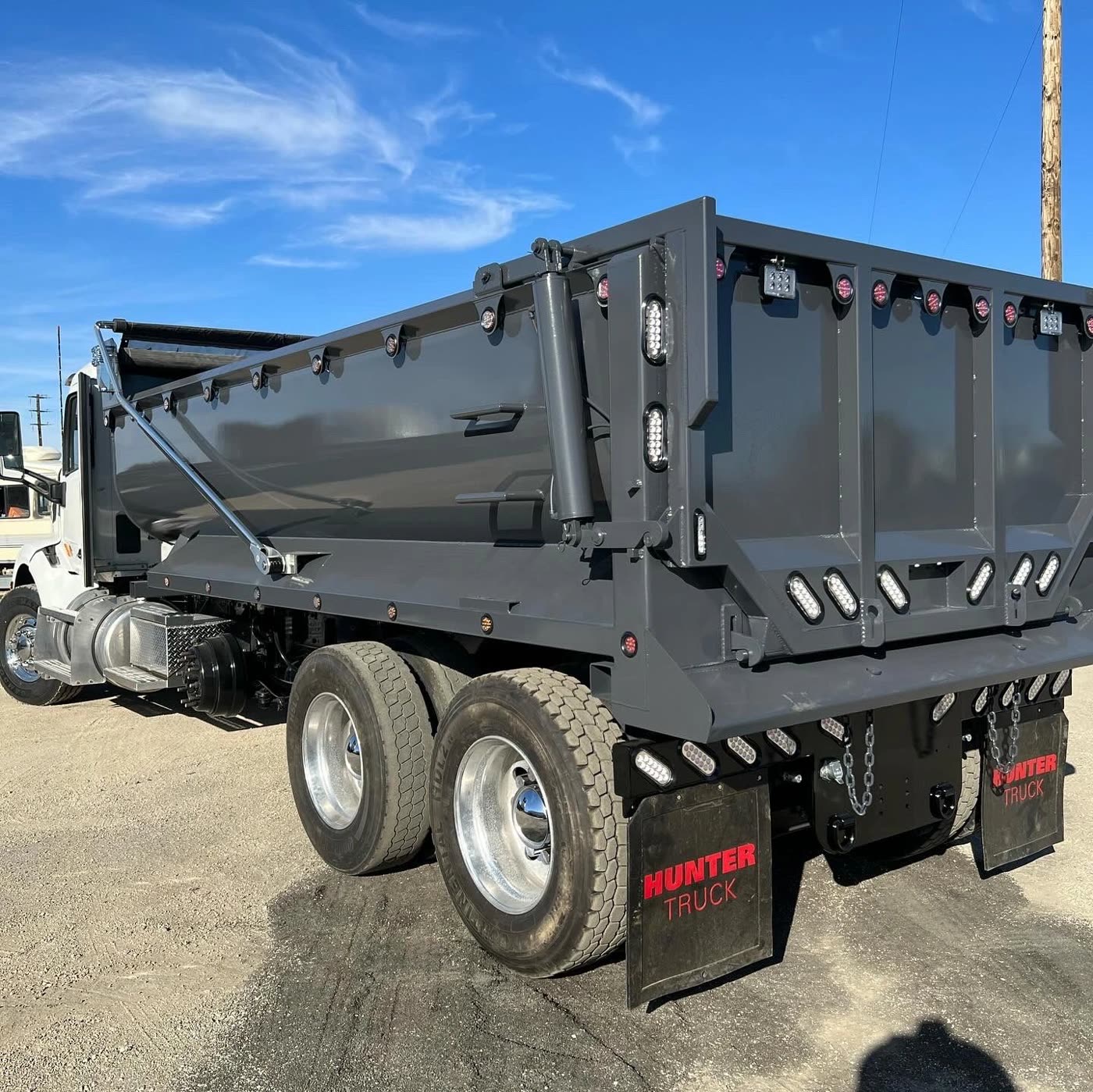 Dump body with an electric tarp system fitted by DM Welding