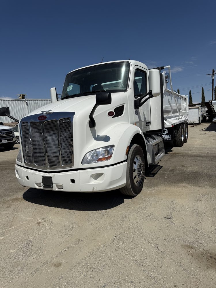 White Peterbilt with its dump body mounted