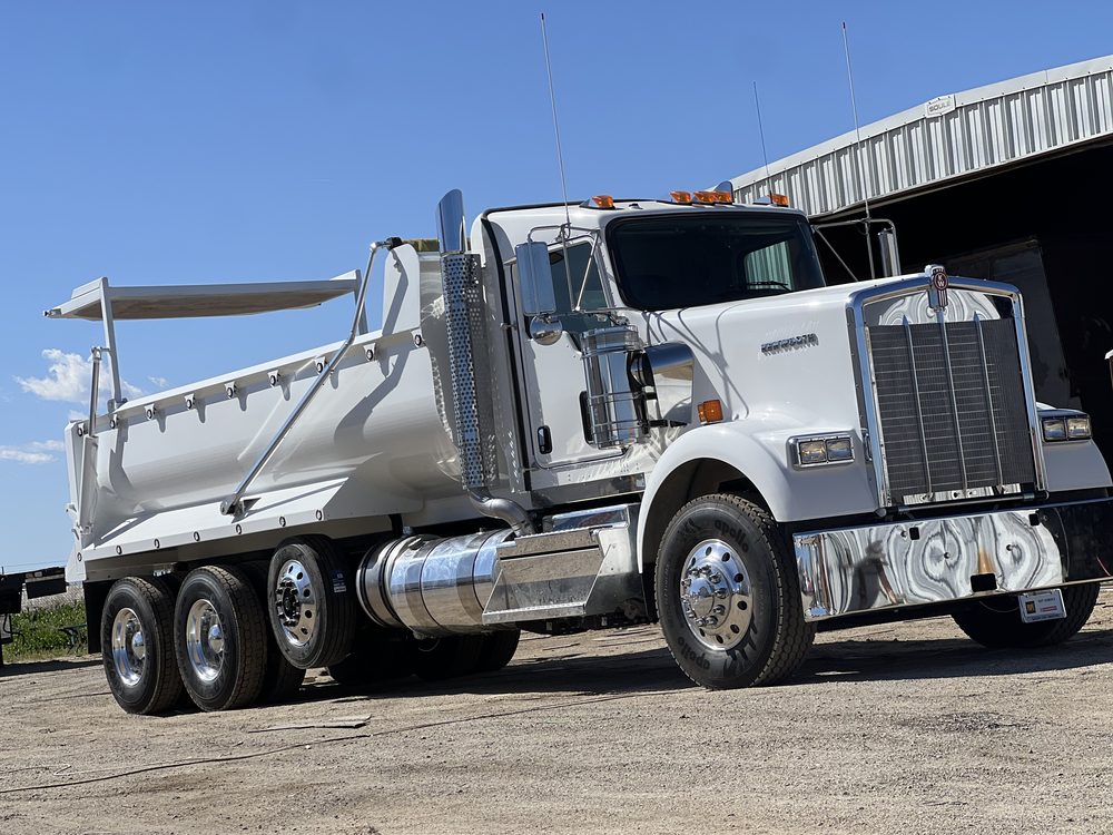 White Kenworth with a silver dump body