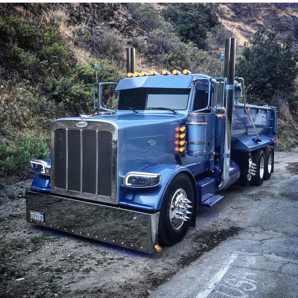 Blue Peterbilt photographed from the front quarter