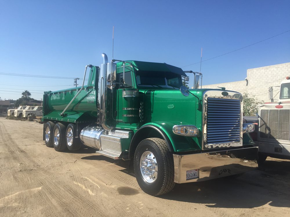 Green dump body on a Peterbilt chassis