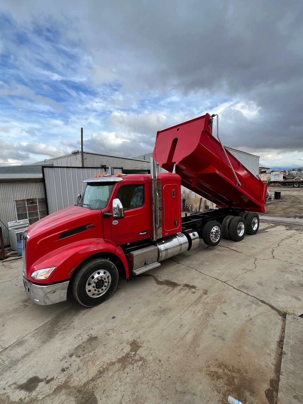 Dump body raised on a telescopic hoist installed by DM Welding